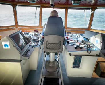 The Captain occupies the Bridge Chair with the vessel on passage