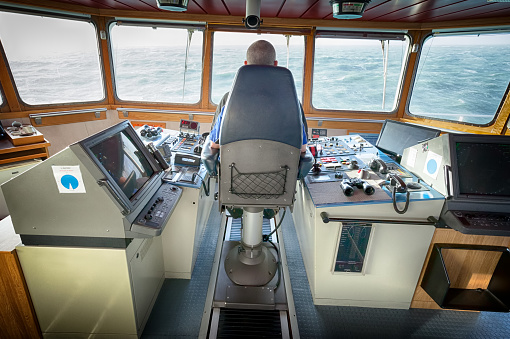 The Captain occupies the Bridge Chair with the vessel on passage